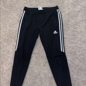 Women's Black Adidas pants.